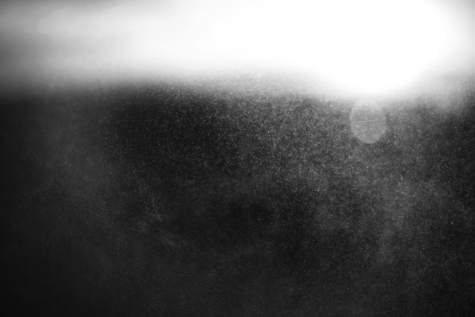 Black and white atmospheric light with mist and heavy tonal contrast